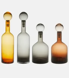 Bubbles And Bottles Large set of 4 glass bottles Bubbles And Bottles Large set of 4 glass bottles