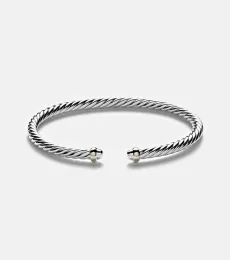 Cable Flex sterling silver and 14kt gold cuff bracelet Cable Flex sterling silver and 14kt gold cuff bracelet