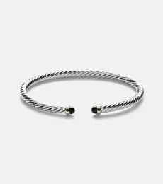 Cable Flex sterling silver and 14kt gold cuff bracelet with onyxes Cable Flex sterling silver and 14kt gold cuff bracelet with onyxes