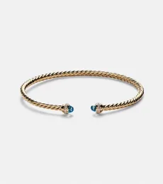 Cablespira Flex 18kt gold cuff bracelet with topazes and diamonds Cablespira Flex 18kt gold cuff bracelet with topazes and diamonds