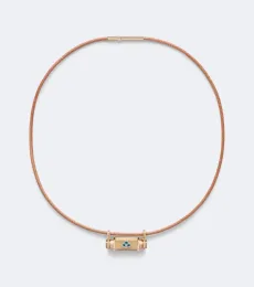 Clover Smash 18kt gold and leather locket necklace with emeralds Clover Smash 18kt gold and leather locket necklace with emeralds