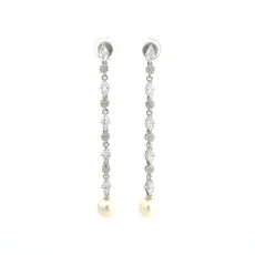 Extravagant Dangling Pearl Silver Earrings