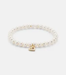 Fluted Heart 14kt gold charm bracelet Fluted Heart 14kt gold charm bracelet