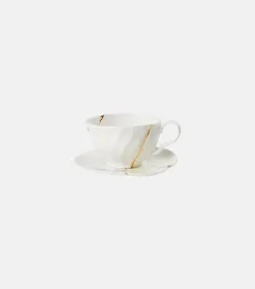 Kintsugi gold-plated porcelain teacup and saucer set by Marcantonio Raimondi Malerba