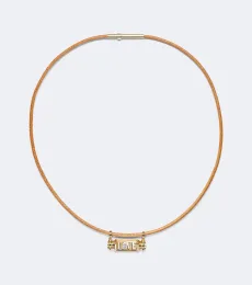 Love Smash 18kt gold and leather pendant necklace with diamond Love Smash 18kt gold and leather pendant necklace with diamond