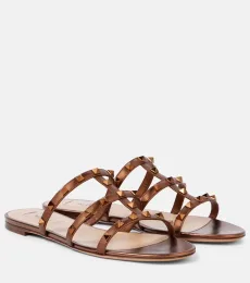 Mules Rockstud en cuir métallisé Mules Rockstud en cuir métallisé