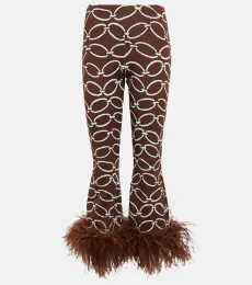 Pantalones estampados con plumas Pantalones estampados con plumas