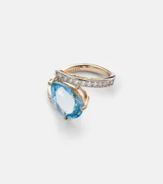 Slanted 14kt gold ring with topaz and diamonds Slanted 14kt gold ring with topaz and diamonds