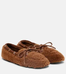 Suede-trimmed shearling boat shoes