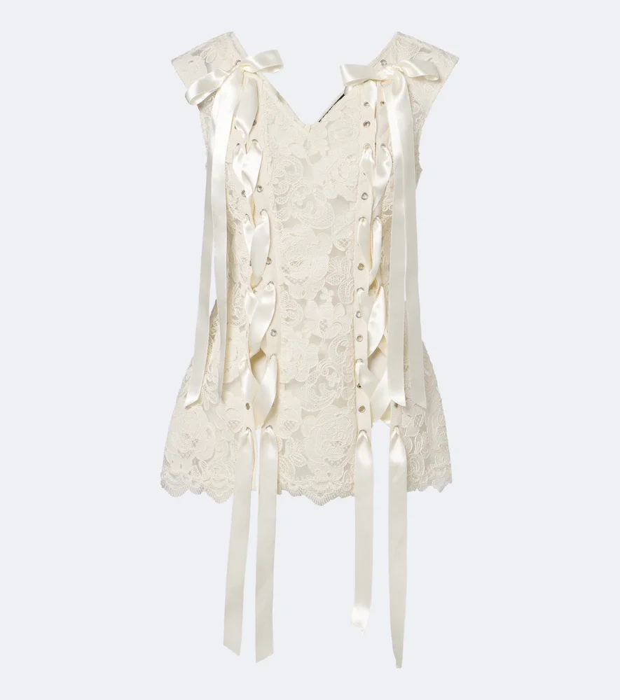 Unraveling bow-detail lace top